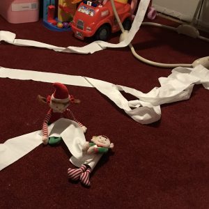 Elves throwing toilet paper all over the room