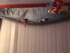 Elf on the shelf ideas: have them climbing the curtains